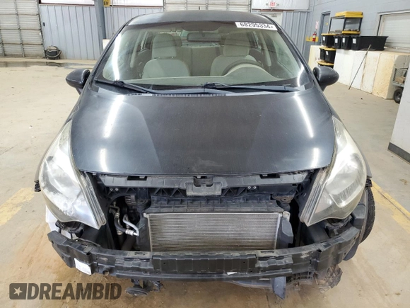 2012 Kia Rio LX with VIN KNADM4A34C6072811, listed as a Copart auction lot 68295334 with 77,167 mi miles and Salvage Title. Bid and sale history available at DreamBid. Image 5.