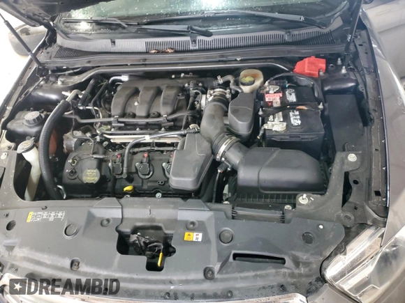 2013 Ford Taurus Limited с VIN 1FAHP2F81DG136504, выставлен на аукционе Copart как лот 56498075 с пробегом 191 342 миль миль и Списание • Salvage title. История ставок и продаж доступна на DreamBid. Изображение 11.