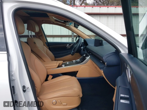 2023 Genesis GV80 with VIN KMUHBDSB2PU105268, listed as a IAAI auction lot 40791181 with 21,569 mi miles and . Bid and sale history available at DreamBid. Image 5.