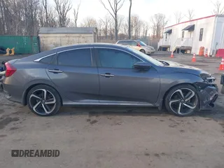 2019 Honda Civic Sport with VIN 2HGFC2F8XKH503867, listed as a IAAI auction lot 41533506 with 66,650 mi miles and . Bid and sale history available at DreamBid. Image 13.