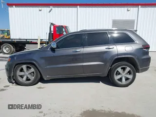 2015 Jeep Grand Cherokee Overland with VIN 1C4RJECT2FC648292, listed as a IAAI auction lot 41806402 with 116,766 mi miles. Bid and sale history available at carsss.com. Image 15.