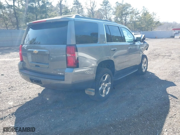 2019 Chevrolet Tahoe LT with VIN 1GNSKBKC0KR121493, listed as a IAAI auction lot 41656734 with 163,994 mi miles. Bid and sale history available at carsss.com. Image 4.