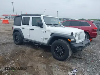 2019 Jeep Wrangler Unlimited Sport Altitude with VIN 1C4HJXDG7KW553468, listed as a IAAI auction lot 42210861 with 109,479 mi miles and . Bid and sale history available at DreamBid. Image 1.