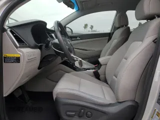 2018 Hyundai Tucson Sport with VIN KM8J33AL7JU772071, listed as a Copart auction lot 87583645 with 56,482 mi miles and Salvage Title. Bid and sale history available at carsss.com. Image 7.
