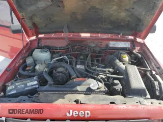1995 Jeep Cherokee SE with VIN 1J4FT27P9SL561969, listed as a Copart auction lot 53295865 with 151,377 mi miles and Salvage title. Bid and sale history available at DreamBid. Image 13.