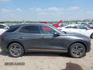 2023 Genesis GV70 2.5T with VIN KMUMADTB9PU084936, listed as a IAAI auction lot 42040232 with 28,201 mi miles and . Bid and sale history available at DreamBid. Image 13.