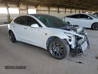 2020 Tesla Model 3 Standard Range Plus with VIN 5YJ3E1EA6LF645215, listed as a Copart auction lot 47882375 with 69,317 mi miles and Salvage Title. Bid and sale history available at DreamBid. Image 4.