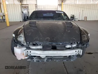 2009 Nissan 370Z z VIN JN1AZ44E19M411715, wystawiony jako Copart lot #56654815 z przebiegiem 123 791 mil mil oraz Szkoda całkowita • Salvage title. Historia ofert i sprzedaży dostępna na DreamBid. Obrazek 5.