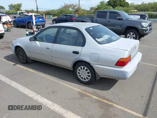 1994 Toyota Corolla Deluxe with VIN JT2AE09B5R0053731, listed as a IAAI auction lot 42606147 with 117,035 mi miles and . Bid and sale history available at DreamBid. Image 3.