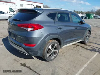 2017 Hyundai Tucson Value with VIN KM8J33A25HU402366, listed as a IAAI auction lot 41814426 with 117,669 mi miles. Bid and sale history available at carsss.com. Image 4.