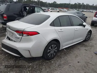 2021 Toyota Corolla Hybrid LE with VIN JTDEAMDE0MJ031684, listed as a IAAI auction lot 41545710 with 40,939 mi miles. Bid and sale history available at carsss.com. Image 4.