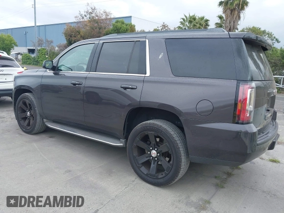 2015 GMC Yukon SLT with VIN 1GKS1BKC6FR245564, listed as a IAAI auction lot 42139295 with 149,088 mi miles. Bid and sale history available at carsss.com. Image 3.