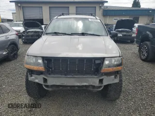 2000 Jeep Grand Cherokee Laredo with VIN 1J4GW48S9YC390448, listed as a Copart auction lot 56985265 with Not provided miles and Salvage title. Bid and sale history available at DreamBid. Image 5.