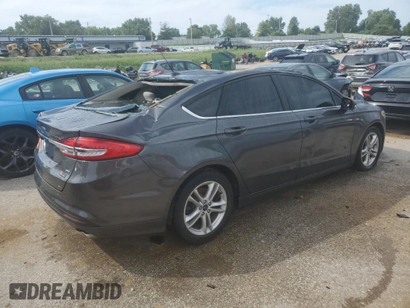 2018 Ford Fusion SE z VIN 3FA6P0H78JR261102, wystawiony jako Copart lot #69963883 z przebiegiem 120 068 mil mil oraz Czysty tytuł • Clean title. Historia ofert i sprzedaży dostępna na DreamBid. Obrazek 3.
