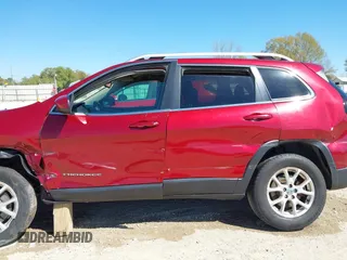 2015 Jeep Cherokee North with VIN 1C4PJMCSXFW654090, listed as a IAAI auction lot 41844434 with 198,592 mi miles. Bid and sale history available at carsss.com. Image 14.