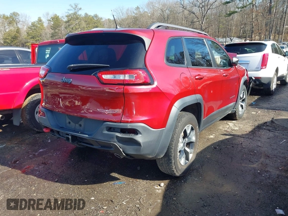 2014 Jeep Cherokee Trailhawk with VIN 1C4PJMBS0EW257133, listed as a IAAI auction lot 41446095 with 82,285 mi miles and . Bid and sale history available at DreamBid. Image 4.