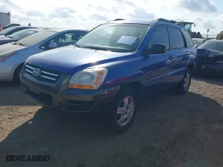 2007 Kia Sportage LX with VIN KNDJF724277382562, listed as a IAAI auction lot 42047497 with 144,079 mi miles. Bid and sale history available at carsss.com. Image 2.