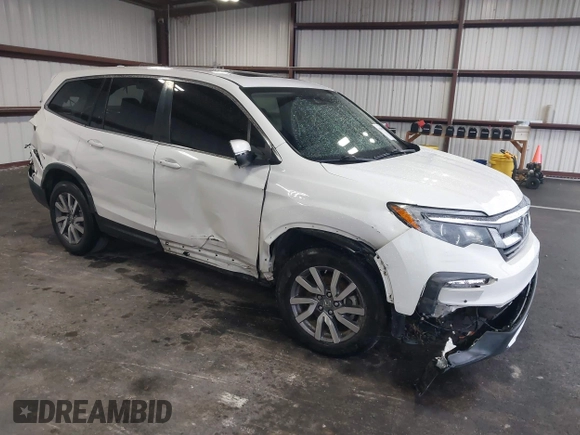 2021 Honda Pilot EX-L with VIN 5FNYF5H57MB022843, listed as a IAAI auction lot 41186957 with 57,836 mi miles. Bid and sale history available at carsss.com. Image 1.
