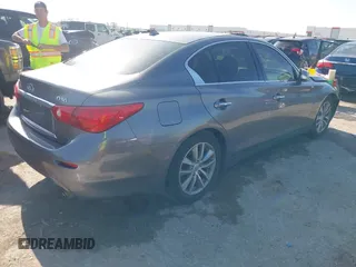 2014 Infiniti Q50 Hybrid Premium with VIN JN1AV7AP4EM691014, listed as a IAAI auction lot 41984130 with 114,230 mi miles and . Bid and sale history available at DreamBid. Image 4.
