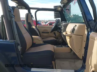 2001 Jeep Wrangler Sport with VIN 1J4FA49S41P334053, listed as a IAAI auction lot 41884967 with 158,258 mi miles. Bid and sale history available at carsss.com. Image 5.