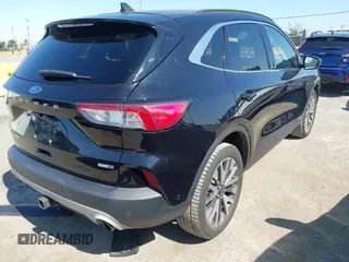 2020 Ford Escape Titanium z VIN 1FMCU9J97LUB18350, wystawiony jako IAAI lot #42574736 z przebiegiem 82 551 mil mil oraz . Historia ofert i sprzedaży dostępna na DreamBid. Obrazek 4.