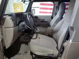 2005 Jeep Wrangler Sport z VIN 1J4FA49S75P325028, wystawiony jako Copart lot #56942315 z przebiegiem 169 988 mil mil oraz Szkoda całkowita • Salvage title. Historia ofert i sprzedaży dostępna na DreamBid. Obrazek 7.