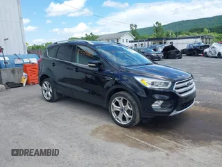 2019 Ford Escape Titanium with VIN 1FMCU9J95KUA09190, listed as a IAAI auction lot 42539445 with 61,027 mi miles and . Bid and sale history available at DreamBid. Image 1.