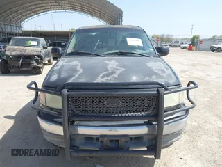 2003 Ford F-150 XLT with VIN 1FTRW07L53KC01651, listed as a IAAI auction lot 41827007 with 233,842 mi miles and . Bid and sale history available at DreamBid. Image 12.