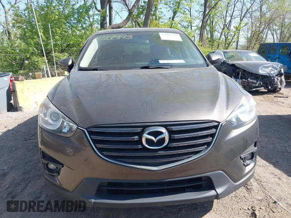 2016 Mazda CX-5 Grand Touring z VIN JM3KE4DY8G0846265, wystawiony jako IAAI lot #42102843 z przebiegiem 159 827 mil mil oraz . Historia ofert i sprzedaży dostępna na DreamBid. Obrazek 12.