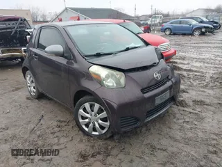 2012 Scion iQ with VIN JTNJJXB00CJ019651, listed as a IAAI auction lot 41667151 with 143,997 mi miles. Bid and sale history available at carsss.com. Image 1.