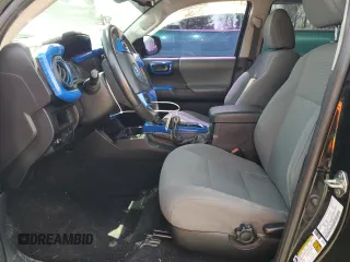 2019 Toyota Tacoma SR z VIN 3TMCZ5AN1KM253032, wystawiony jako Copart lot #52598445 z przebiegiem 69 489 mil mil oraz Szkoda całkowita • Salvage title. Historia ofert i sprzedaży dostępna na DreamBid. Obrazek 7.