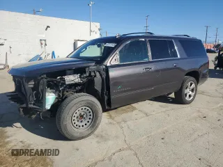 2018 Chevrolet Suburban Premier with VIN 1GNSCJKC7JR188937, listed as a Copart auction lot 49741655 with 106,956 mi miles and Salvage title. Bid and sale history available at DreamBid. Image 1.