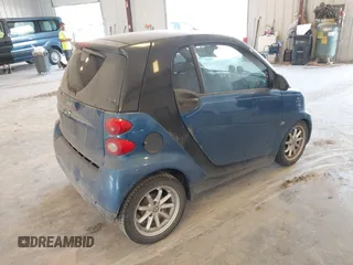 2009 Smart fortwo Pure with VIN WMEEJ31X89K228315, listed as a IAAI auction lot 42662931 with 60,666 mi miles and . Bid and sale history available at DreamBid. Image 4.
