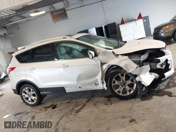 2016 Ford Escape Titanium with VIN 1FMCU9J90GUA18743, listed as a IAAI auction lot 42419730 with 102,666 mi miles and . Bid and sale history available at DreamBid. Image 14.