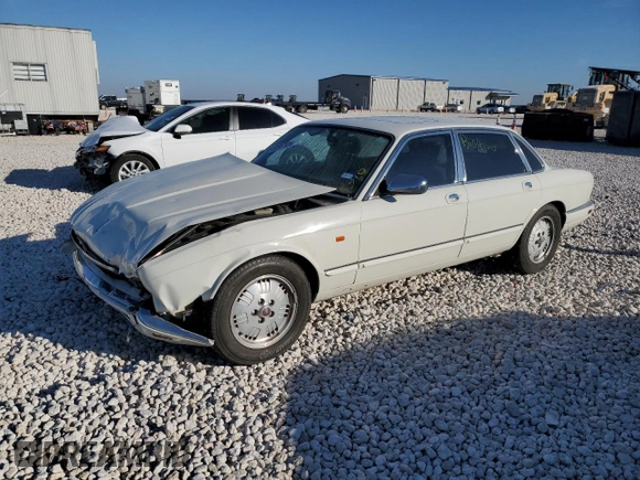 1995 Jaguar XJ with VIN SAJKX1745SC739290, listed as a Copart auction lot 82887524 with Not provided miles and Salvage title. Bid and sale history available at DreamBid. Image 1.