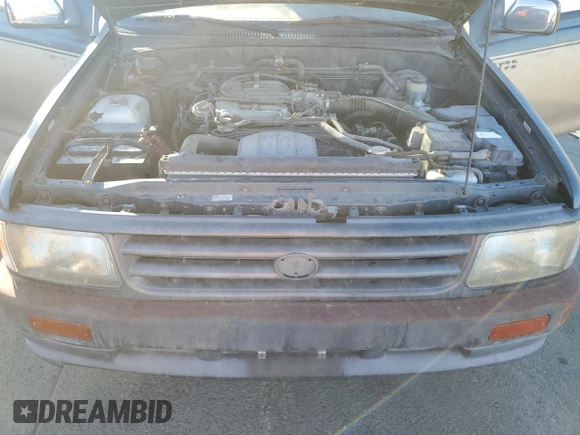 1993 Toyota T100 z VIN JT4VD10C2P0007486, wystawiony jako Copart lot #77669724 z przebiegiem 150 936 mil mil oraz Tytuł czysty. Historia ofert i sprzedaży dostępna na DreamBid. Obrazek 11.