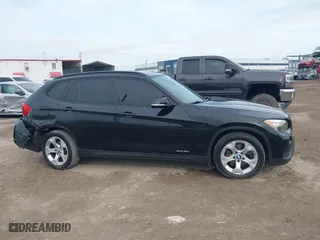 2014 BMW X1 sDrive28i with VIN WBAVM1C54EVW46561, listed as a IAAI auction lot 41880387 with 125,096 mi miles. Bid and sale history available at carsss.com. Image 13.