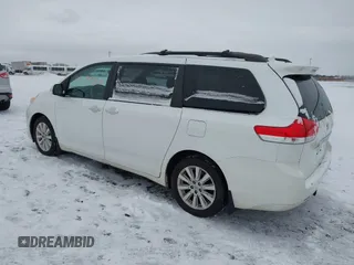 2013 Toyota Sienna XLE with VIN 5TDDK3DC2DS053559, listed as a IAAI auction lot 41299824 with 175,611 mi miles and . Bid and sale history available at DreamBid. Image 3.