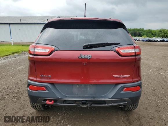 2014 Jeep Cherokee Trailhawk z VIN 1C4PJMBS2EW130125, wystawiony jako Copart lot #57830635 z przebiegiem 117 811 mil mil oraz Szkody całkowita. Historia ofert i sprzedaży dostępna na DreamBid. Obrazek 6.