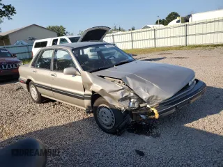 1989 Mitsubishi Galant with VIN JA3BR56V1KZ052149, listed as a Copart auction lot 69987544 with 74,232 mi miles and Salvage Title. Bid and sale history available at DreamBid. Image 4.