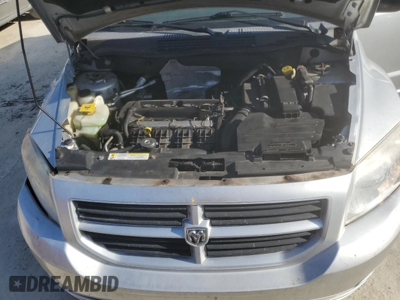 2007 Dodge Caliber with VIN 1B3HB28B07D111196, listed as a Copart auction lot 52488495 with 123,409 mi miles and Salvage Title. Bid and sale history available at DreamBid. Image 12.