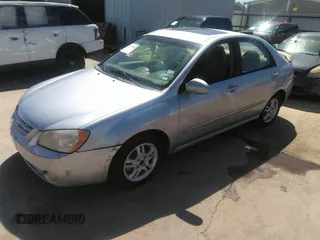 2005 Kia Spectra LX with VIN KNAFE121055121500, listed as a IAAI auction lot 39677018 with 142,307 mi miles. Bid and sale history available at carsss.com. Image 2.