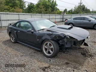 2002 Ford Mustang GT Deluxe with VIN 1FAFP42X62F236827, listed as a Copart auction lot 56749845 with 60,665 mi miles and Salvage title. Bid and sale history available at DreamBid. Image 4.