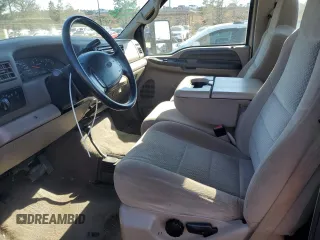 2002 Ford F-250 XL with VIN 1FTNF21L02EA83007, listed as a Copart auction lot 87880345 with 104,889 mi miles and Salvage title. Bid and sale history available at DreamBid. Image 7.