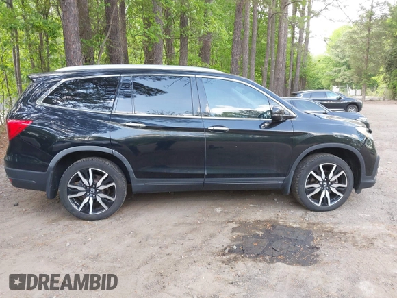 2019 Honda Pilot Touring 7-Passenger with VIN 5FNYF6H60KB030990, listed as a IAAI auction lot 42160762 with 68,807 mi miles and . Bid and sale history available at DreamBid. Image 13.