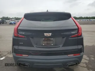 2021 Cadillac XT4 AWD Luxury with VIN 1GYFZBR4XMF014647, listed as a Copart auction lot 63800444 with 49,724 mi miles and Salvage Title. Bid and sale history available at carsss.com. Image 6.