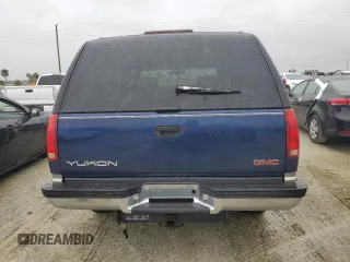 1999 GMC Yukon with VIN 1GKEK13R2XJ739931, listed as a Copart auction lot 74583734 with 115,605 mi miles and Salvage Title. Bid and sale history available at carsss.com. Image 6.