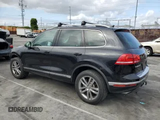 2016 Volkswagen Touareg Sport с VIN WVGEF9BP3GD011138, выставлен на аукционе Copart как лот 53557195 с пробегом 75 825 миль миль и Списание • Salvage title. История ставок и продаж доступна на DreamBid. Изображение 2.