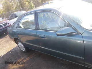 1998 Mazda 626 DX with VIN 1YVGF22C4W5768778, listed as a IAAI auction lot 41971066 with 119,168 mi miles. Bid and sale history available at carsss.com. Image 13.
