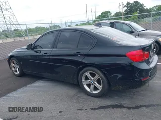 2015 BMW 3 Series 320i with VIN WBA3B1G57FNT05826, listed as a IAAI auction lot 42103193 with 128,800 mi miles. Bid and sale history available at carsss.com. Image 13.